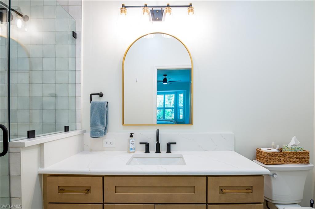 21441 Knighton Run Estero, FL 33928 - Photo 16 of 50 a bathroom with a sink and a mirror