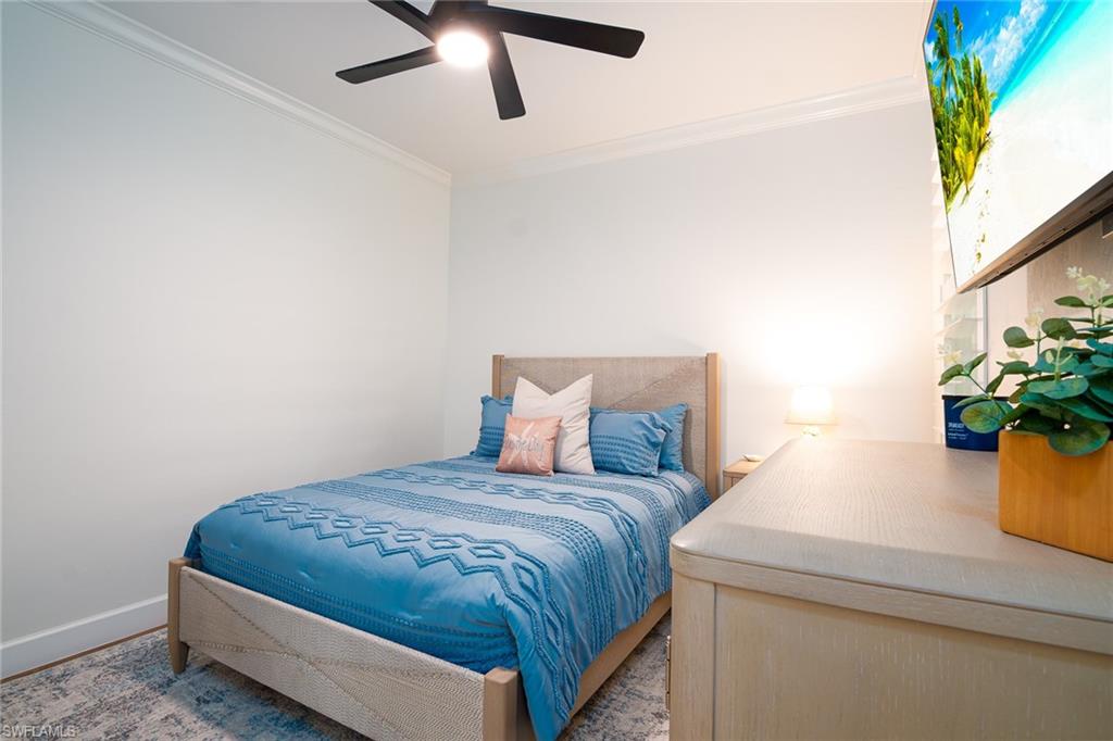 21441 Knighton Run Estero, FL 33928 - Photo 20 of 50 a bedroom with a bed and potted plant