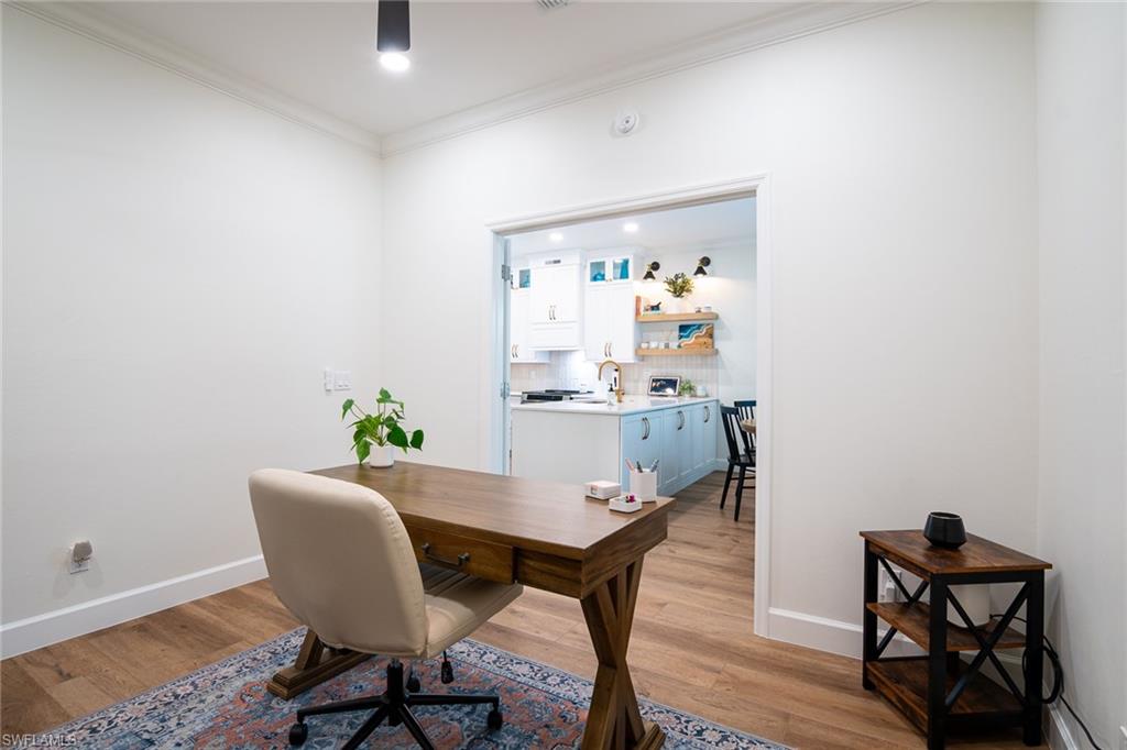 21441 Knighton Run Estero, FL 33928 - Photo 24 of 50 a view of a dining room with furniture and wooden floor