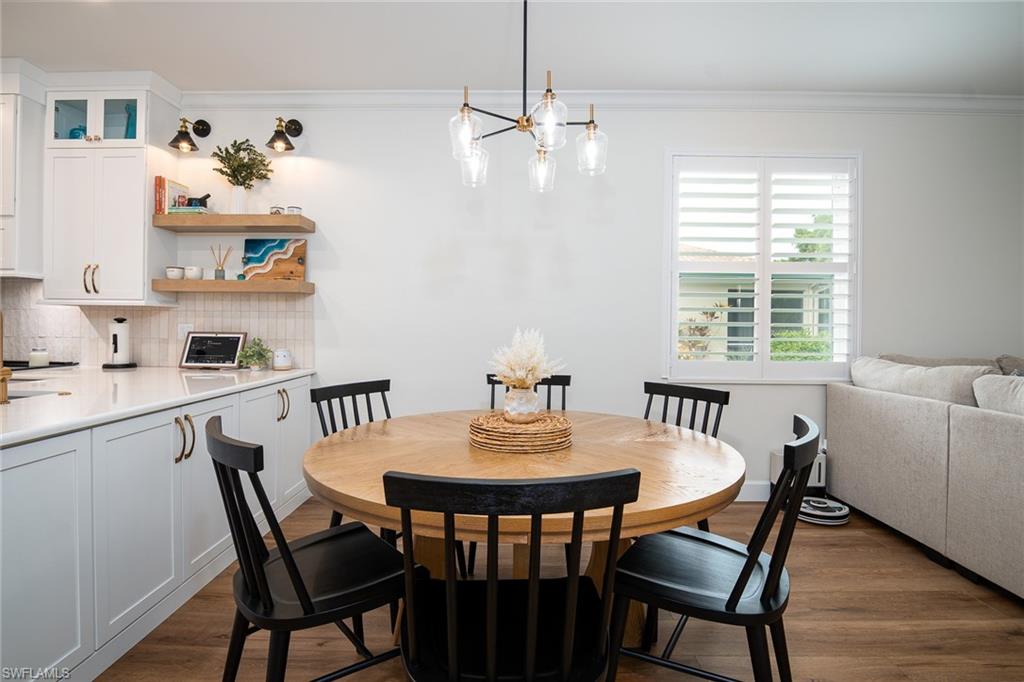 21441 Knighton Run Estero, FL 33928 - Photo 26 of 50 a view of a dining room with furniture and a window