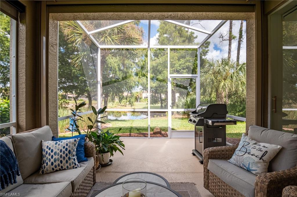 21441 Knighton Run Estero, FL 33928 - Photo 28 of 50 a living room with furniture and a window