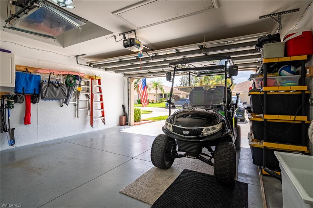 21441 Knighton Run Estero, FL 33928 - Photo 34 of 50 a room with gym equipment and a mirror