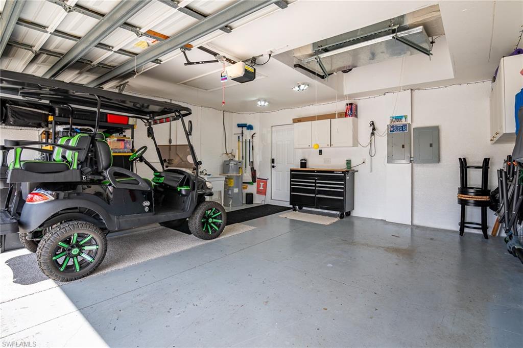 21441 Knighton Run Estero, FL 33928 - Photo 36 of 50 a view of a garage with parked cars