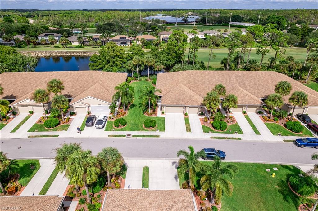 21441 Knighton Run Estero, FL 33928 - Photo 43 of 50 an aerial view of a house with a yard and lake view