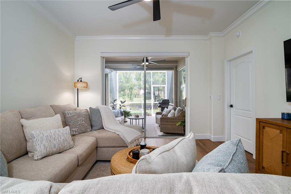 21441 Knighton Run Estero, FL 33928 - Photo 7 of 50 a living room with furniture and a window