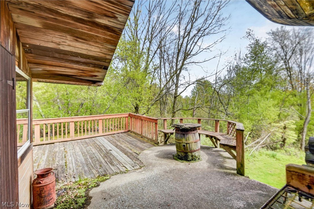 1526 Stevenson Road Ashtabula, OH 44004 - Photo 42 of 50 Expansive outdoor deck featuring wood-finish flooring, a wood railing system, and built-in wood benches