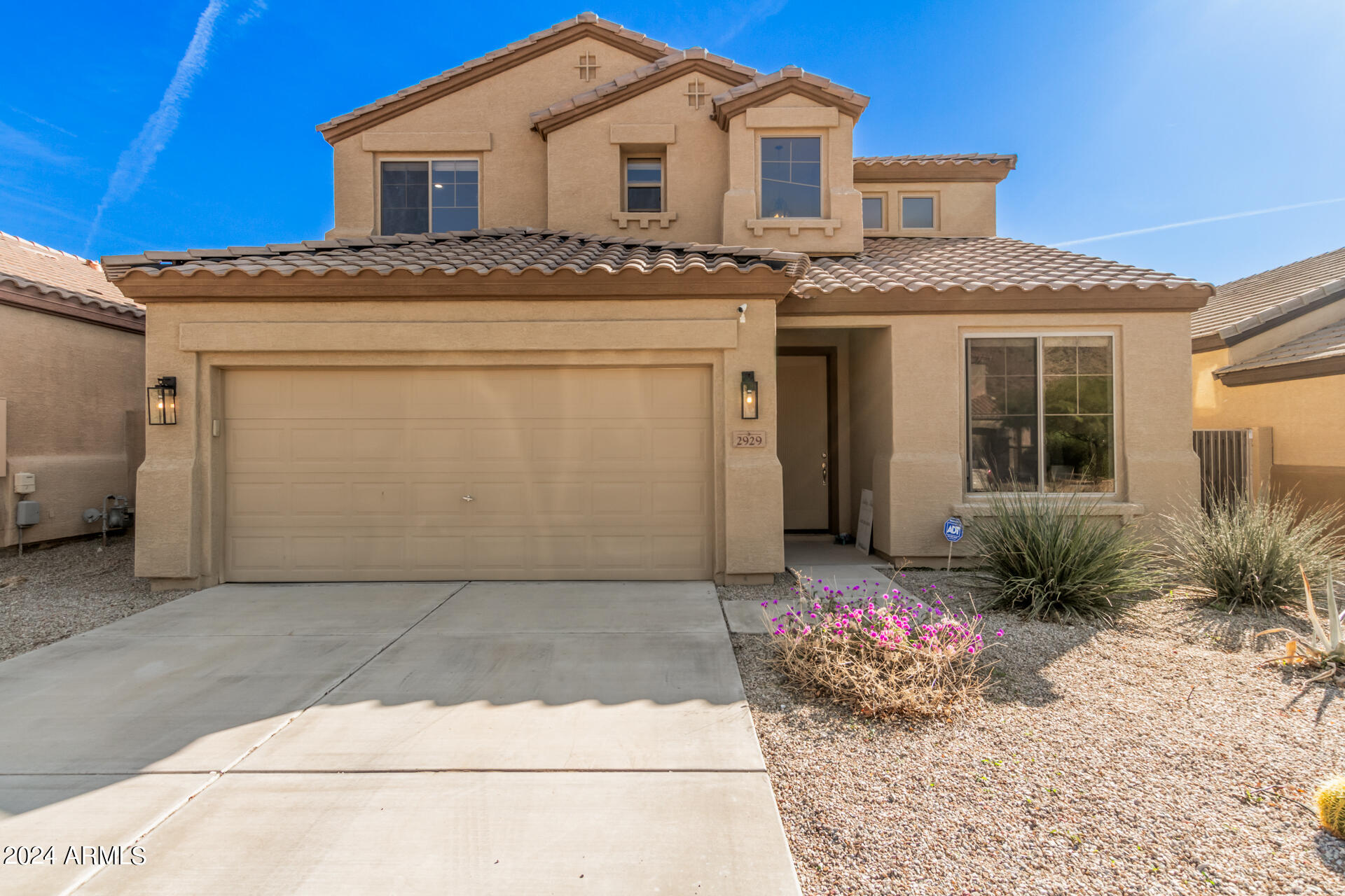 2929 West Silver Fox Way Phoenix, AZ 85045 - Photo 1 of 25 a front view of a house with a garden