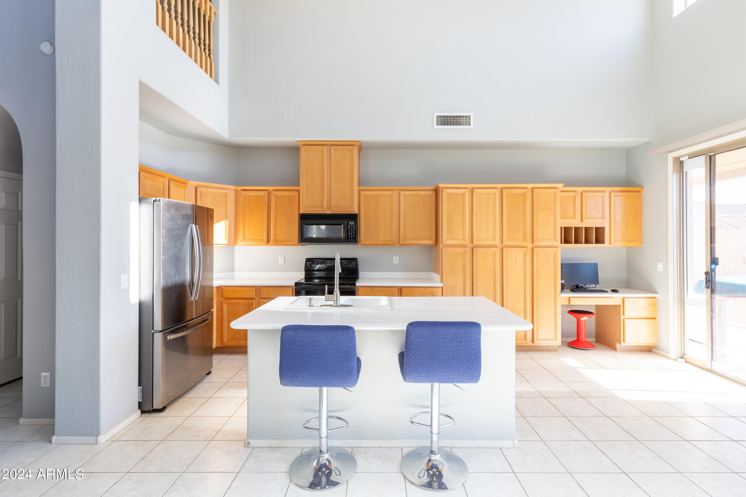 2929 West Silver Fox Way Phoenix, AZ 85045 - Photo 13 of 25 a large kitchen with a table and chairs