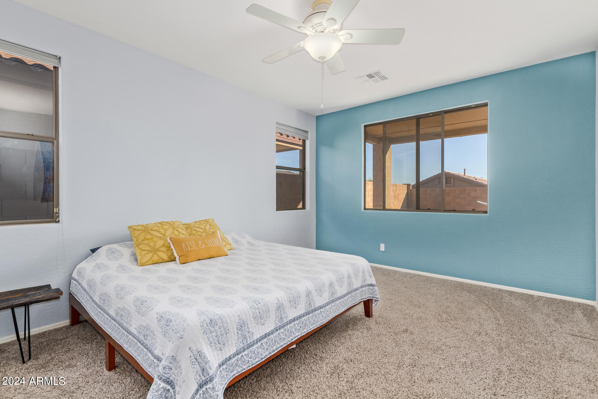 2929 West Silver Fox Way Phoenix, AZ 85045 - Photo 15 of 25 a bedroom with a bed and a chandelier