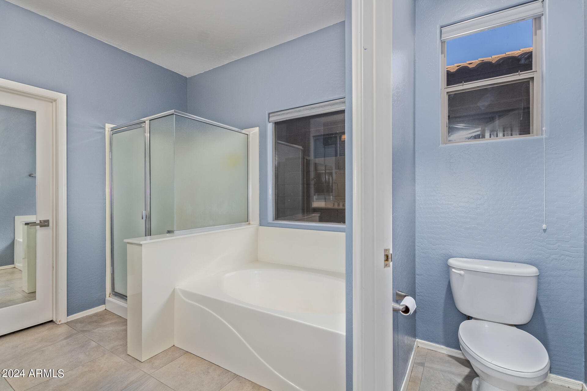 2929 West Silver Fox Way Phoenix, AZ 85045 - Photo 17 of 25 a bathroom with a granite countertop sink toilet and shower