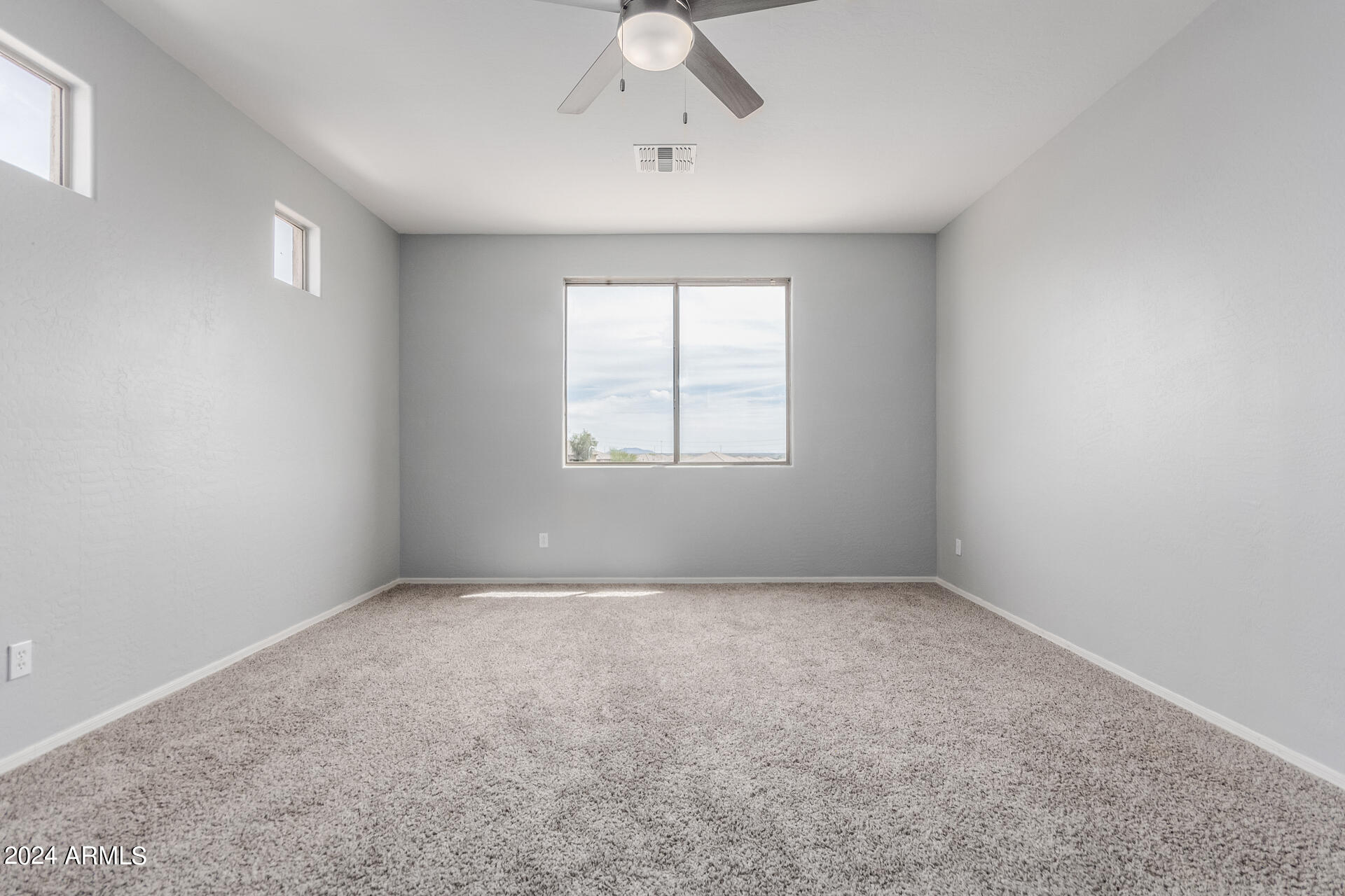 2929 West Silver Fox Way Phoenix, AZ 85045 - Photo 18 of 25 a view of an empty room with a window
