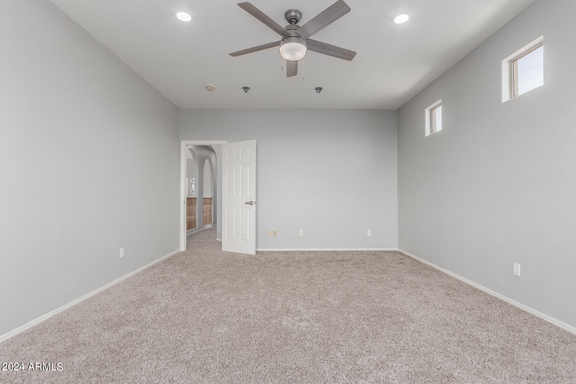 2929 West Silver Fox Way Phoenix, AZ 85045 - Photo 19 of 25 an empty room with chandelier fan