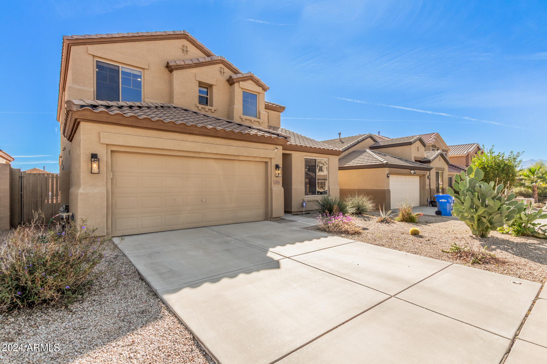 2929 West Silver Fox Way Phoenix, AZ 85045 - Photo 2 of 25 a view of a white house with a outdoor space