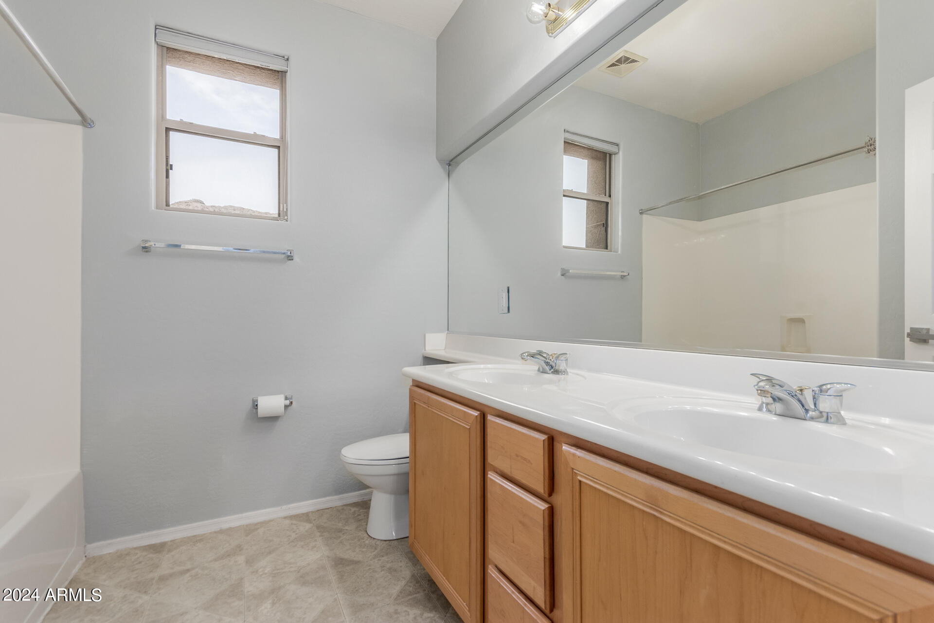 2929 West Silver Fox Way Phoenix, AZ 85045 - Photo 21 of 25 a view of bathroom with a sink and a toilet