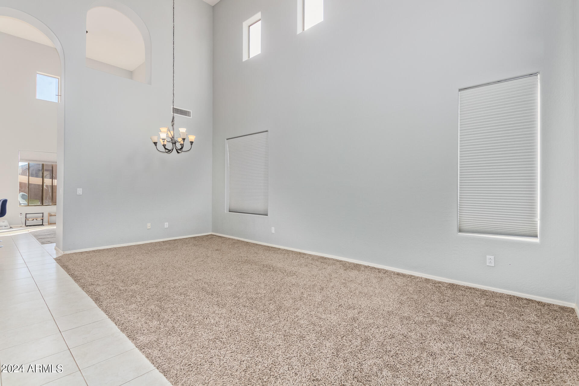 2929 West Silver Fox Way Phoenix, AZ 85045 - Photo 5 of 25 an empty room with windows