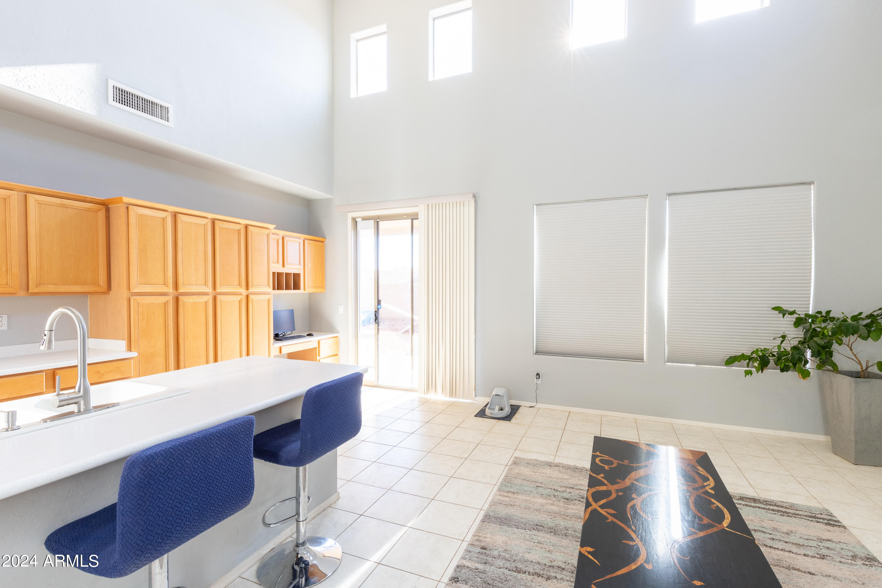 2929 West Silver Fox Way Phoenix, AZ 85045 - Photo 9 of 25 a large white kitchen with a large window