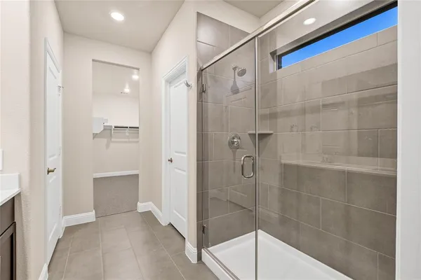 a bathroom with a shower and a sink
