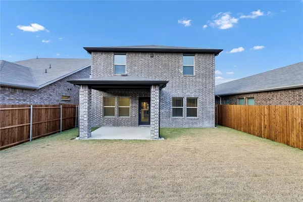 a view of a house with a garage and yard