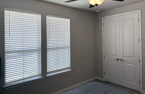 a view of a room that has a window in it