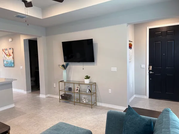 a living room with furniture and a flat screen tv