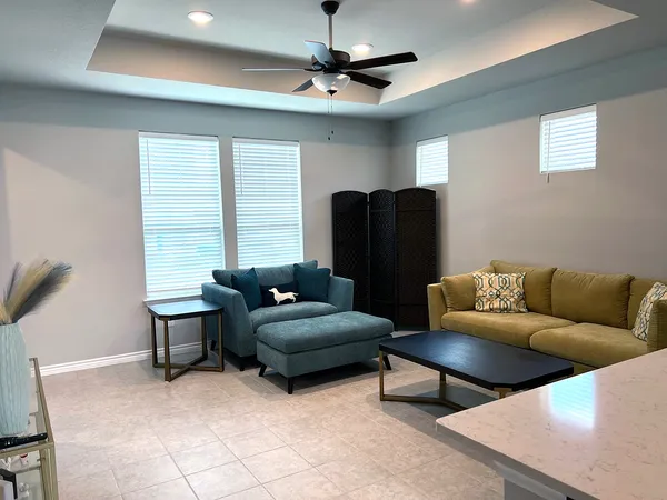 a living room with furniture and a window