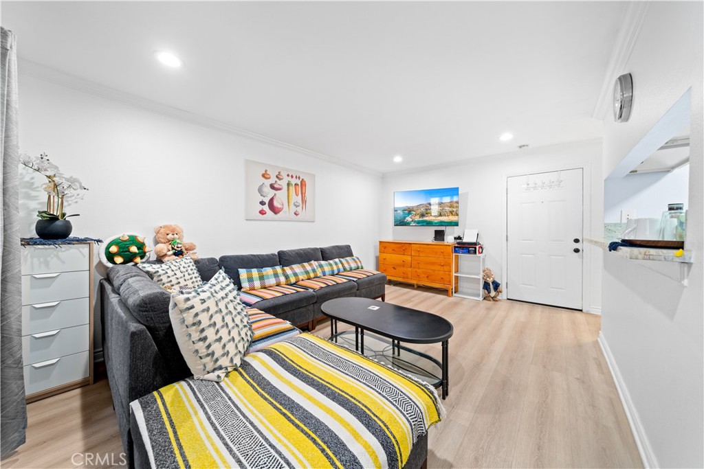 10655 Lemon Avenue, Unit 3107 Rancho Cucamonga, CA 91737 - Photo 13 of 55 a bedroom with furniture and a wooden floor