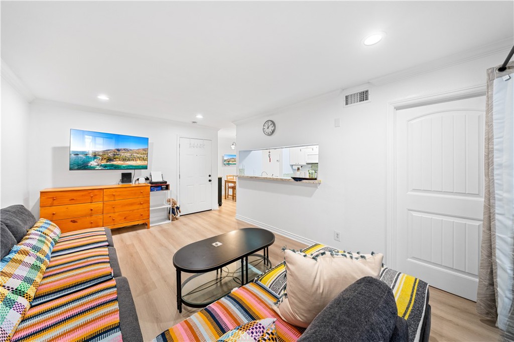 10655 Lemon Avenue, Unit 3107 Rancho Cucamonga, CA 91737 - Photo 14 of 55 a bedroom with a bed and wooden floor