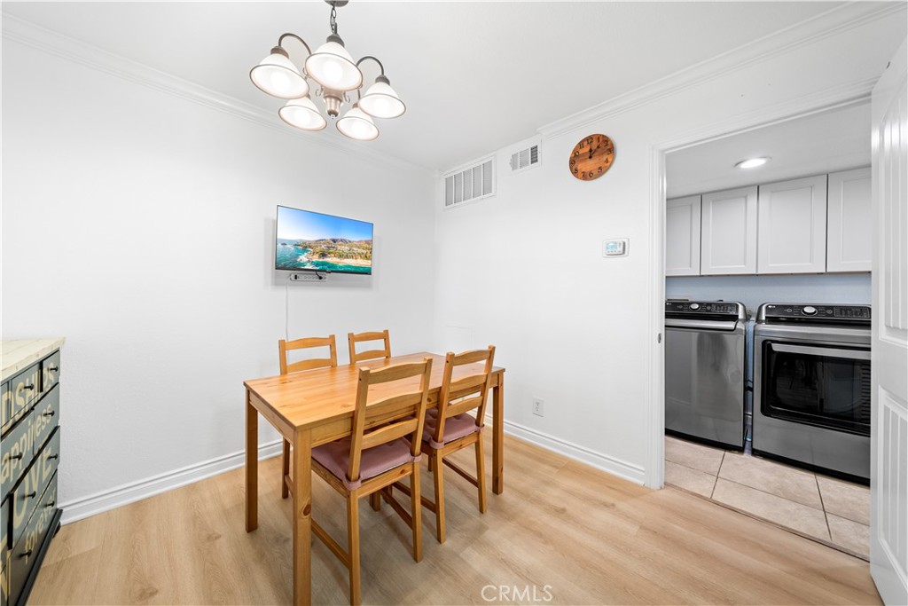 10655 Lemon Avenue, Unit 3107 Rancho Cucamonga, CA 91737 - Photo 15 of 55 a view of a dining room with furniture and wooden floor