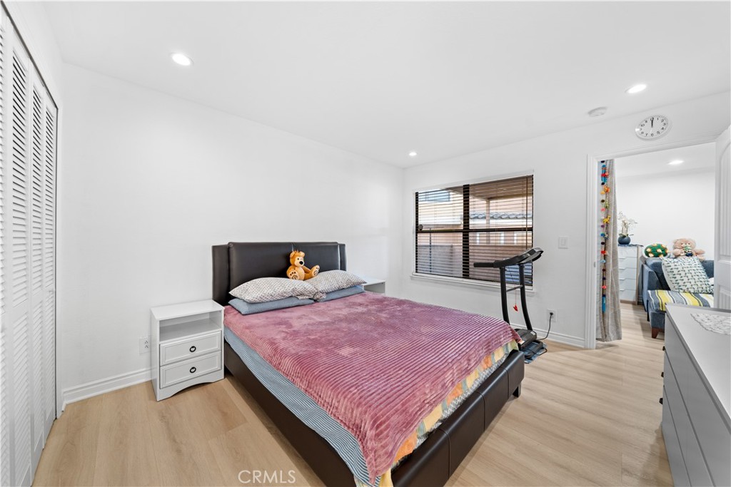 10655 Lemon Avenue, Unit 3107 Rancho Cucamonga, CA 91737 - Photo 27 of 55 a bedroom with a bed and a flat tv screen on a dresser