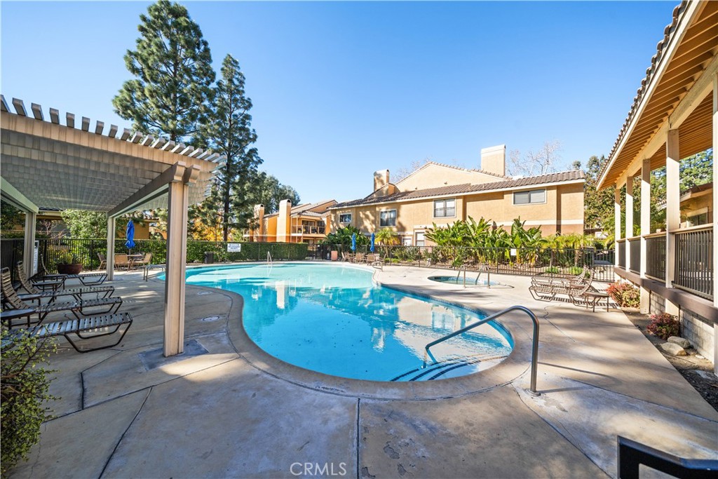 10655 Lemon Avenue, Unit 3107 Rancho Cucamonga, CA 91737 - Photo 36 of 55 a view of a swimming pool with a patio