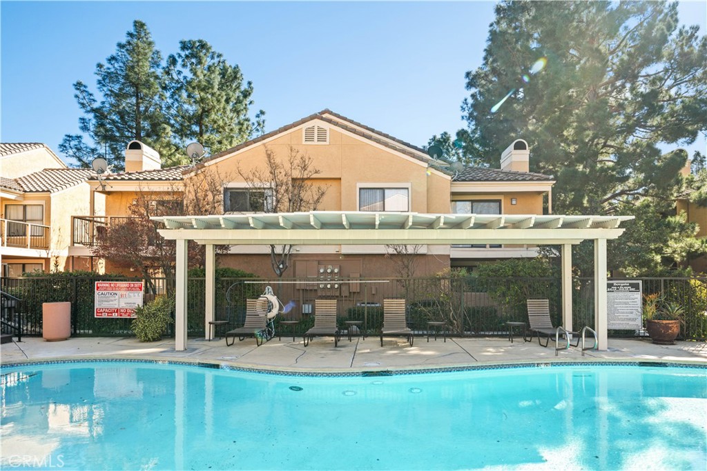 10655 Lemon Avenue, Unit 3107 Rancho Cucamonga, CA 91737 - Photo 39 of 55 a front view of house with yard and green space