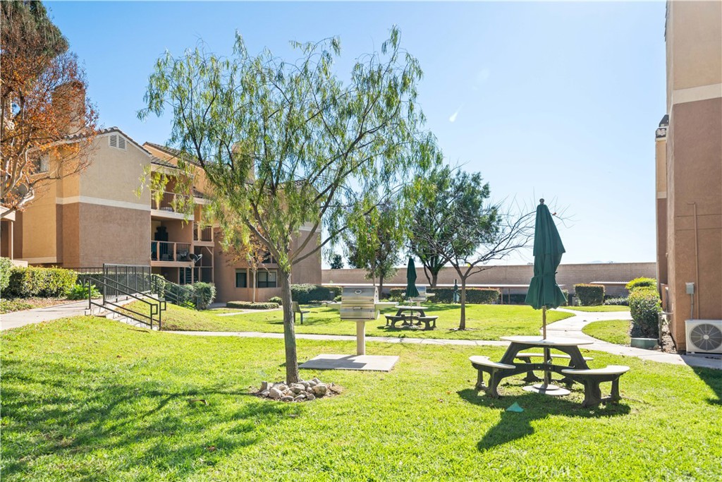 10655 Lemon Avenue, Unit 3107 Rancho Cucamonga, CA 91737 - Photo 40 of 55 a swimming pool with outdoor seating and yard
