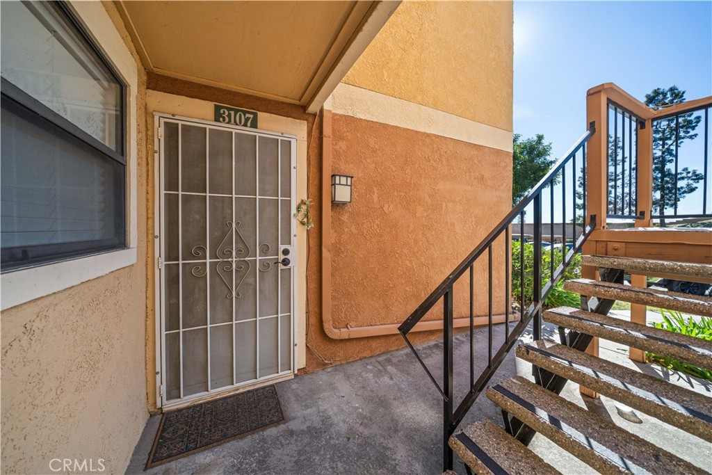 10655 Lemon Avenue, Unit 3107 Rancho Cucamonga, CA 91737 - Photo 4 of 55 a view of an entryway with wooden floor