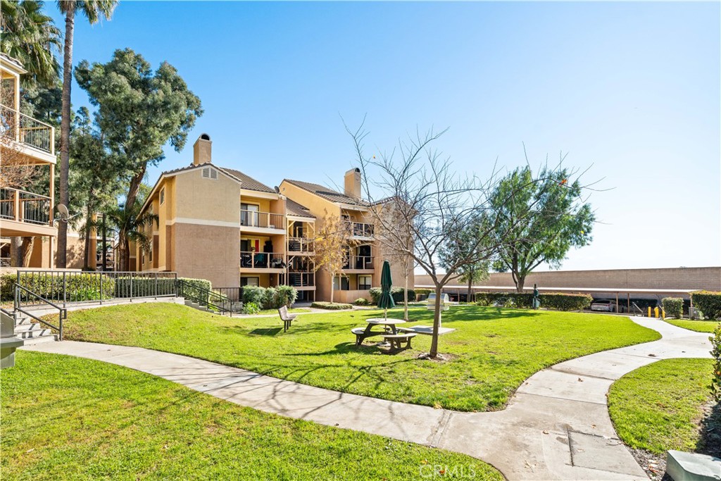 10655 Lemon Avenue, Unit 3107 Rancho Cucamonga, CA 91737 - Photo 41 of 55 a front view of building with yard