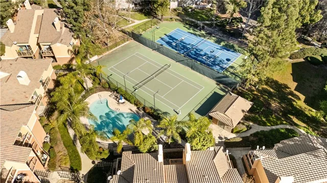 an aerial view of residential building and ocean view