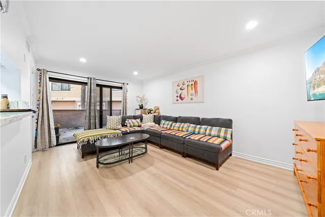 a living room with furniture and large window