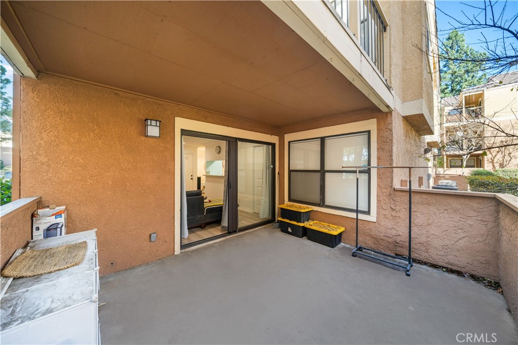 10655 Lemon Avenue, Unit 3107 Rancho Cucamonga, CA 91737 - Photo 10 of 55 a view of a livingroom with furniture and floor to ceiling window