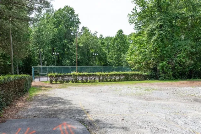 a view of a park with large trees