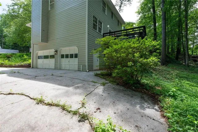 a backyard of a house with lots of green space