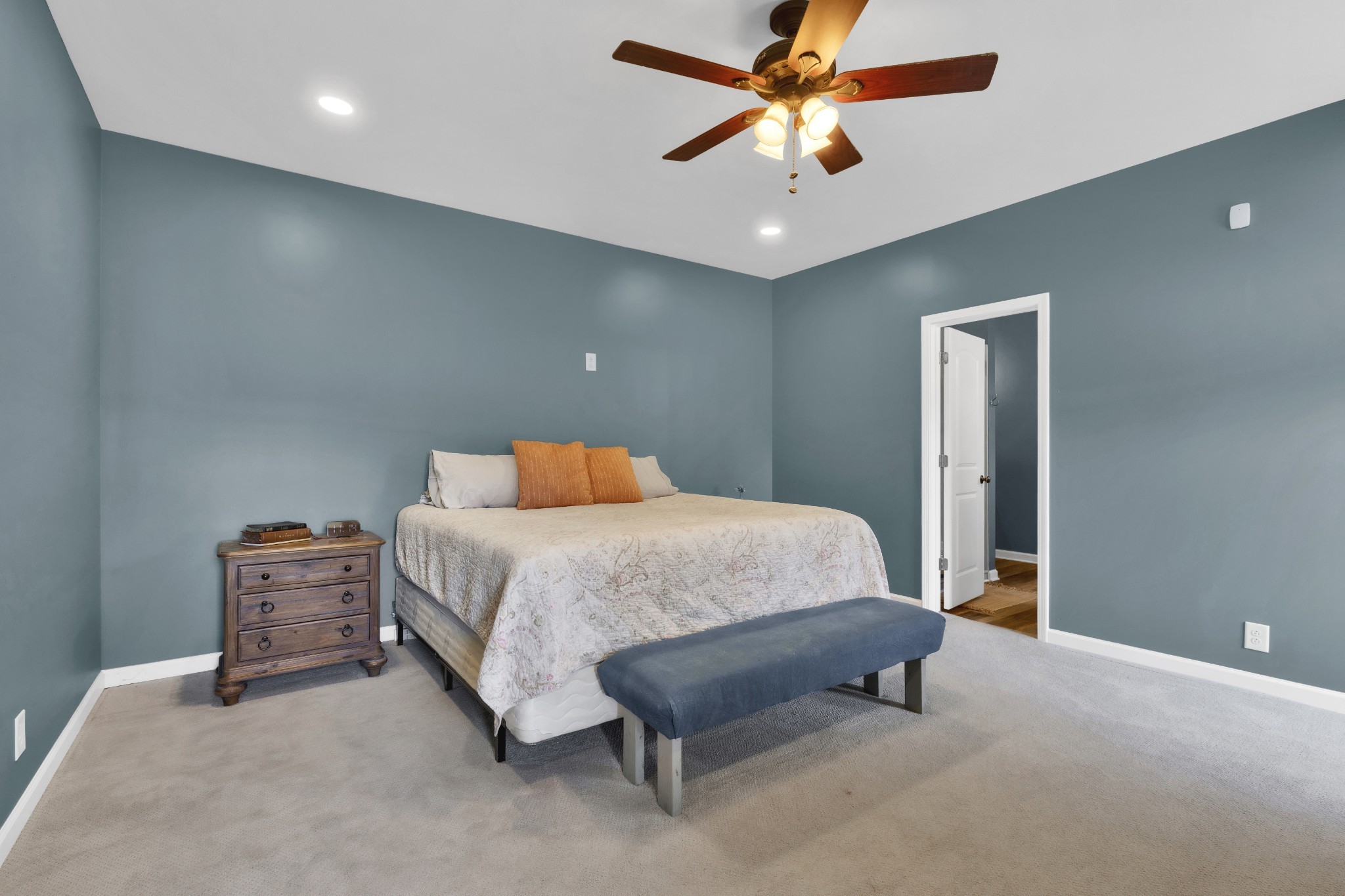 3988 Fykes Grove Road Cedar Hill, TN 37032 - Photo 21 of 50 a bedroom with a bed and a chandelier
