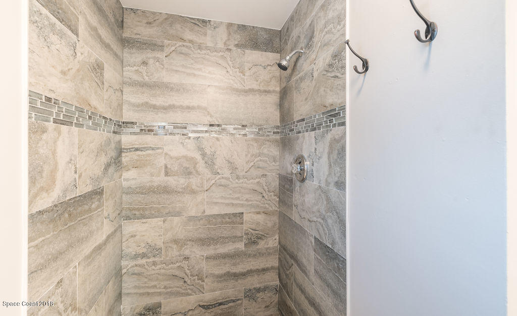 731 Raleigh Road Southeast Palm Bay, FL 32909 - Photo 23 of 36 a bathroom with a shower
