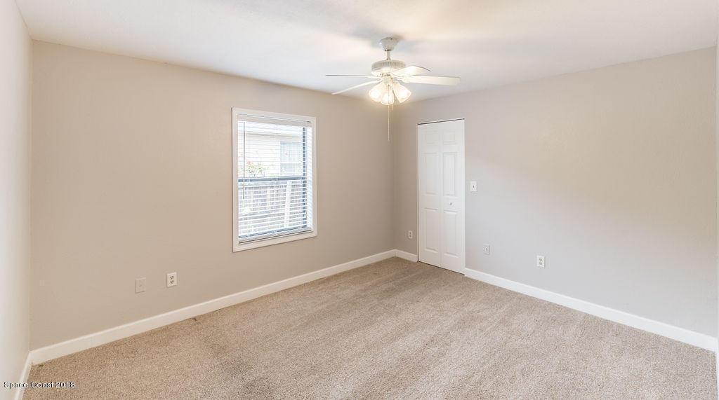 731 Raleigh Road Southeast Palm Bay, FL 32909 - Photo 24 of 36 a view of an empty room with windows