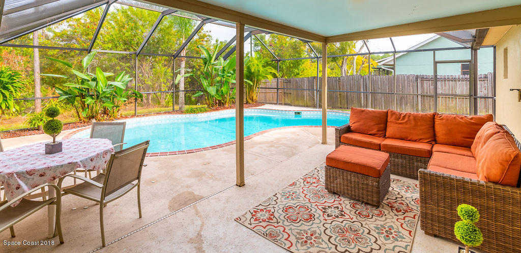 731 Raleigh Road Southeast Palm Bay, FL 32909 - Photo 28 of 36 a reading room with furniture and a large window