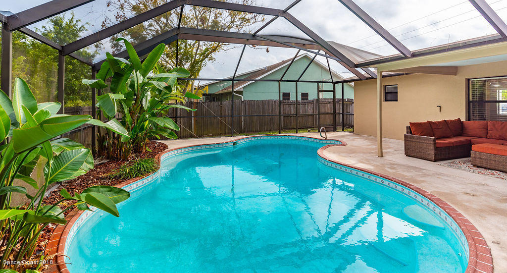 731 Raleigh Road Southeast Palm Bay, FL 32909 - Photo 32 of 36 a view of swimming pool with a backyard