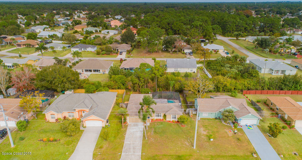 731 Raleigh Road Southeast Palm Bay, FL 32909 - Photo 34 of 36 an aerial view of residential houses with outdoor space