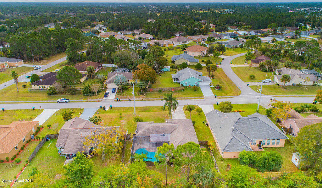 731 Raleigh Road Southeast Palm Bay, FL 32909 - Photo 35 of 36 an aerial view of residential houses with outdoor space and swimming pool