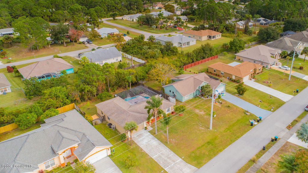 731 Raleigh Road Southeast Palm Bay, FL 32909 - Photo 36 of 36 an aerial view of residential houses with outdoor space