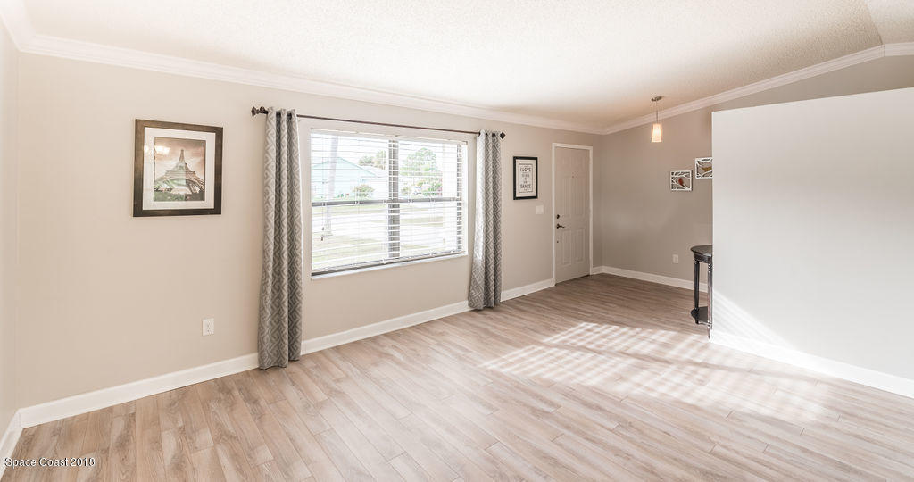 731 Raleigh Road Southeast Palm Bay, FL 32909 - Photo 5 of 36 an empty room with windows and closet