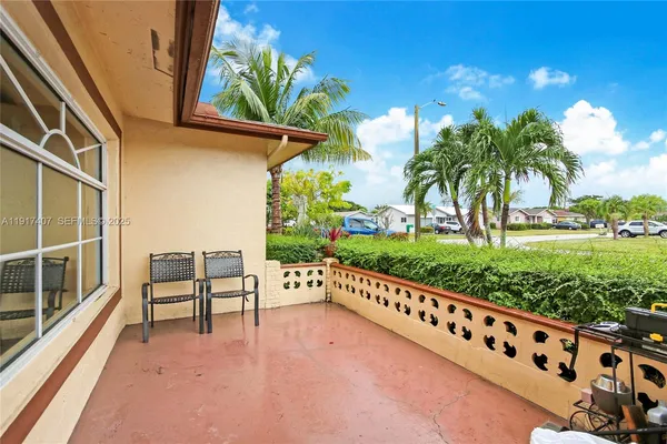 a view of a terrace with chairs and a table
