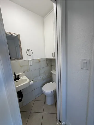 a bathroom with a toilet and a sink